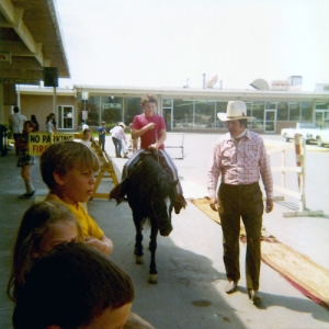 Paul rides Admiral in a parking lot in the early 1970s